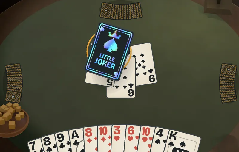 Mid-trick: the Little Joker lands on the six and nine, with the player’s hand fanned below.